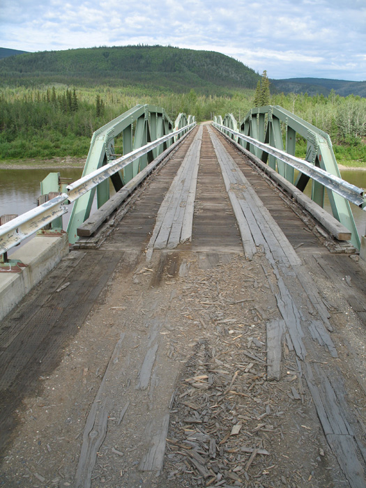Shall we cross? The bridge looks like to could use some fresh wood..