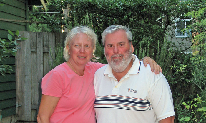 Our fiends Judy and Mike Wolinski pose by their backyard garden in Bothel, WA
