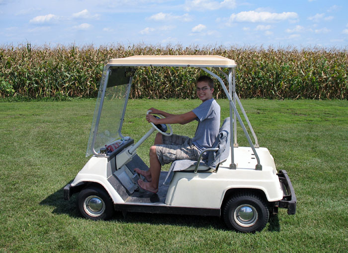 Gas powered golf cart + corn field = big smiles!!