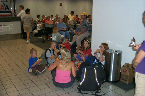 Enjoying a snack at the AA gate in San Juan