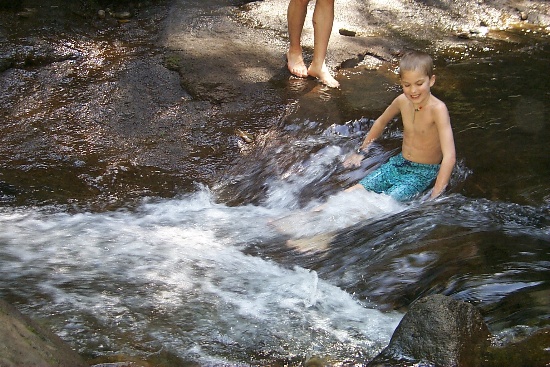 Erik playing in the runoff water