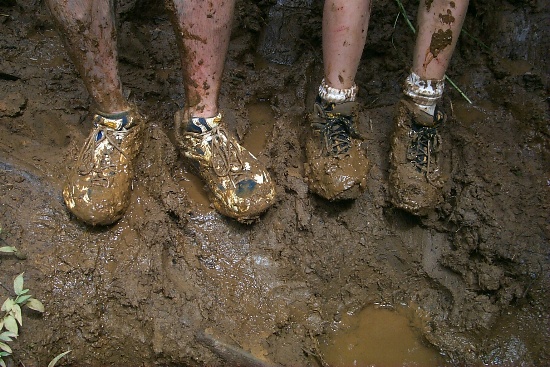 Erik and Naveeds feet buried in mud