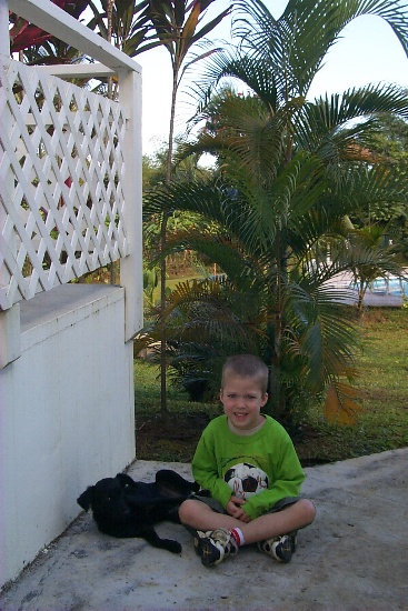Karl plays with a local stary puppy