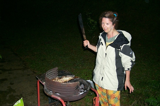 Susan is tending the BBQ