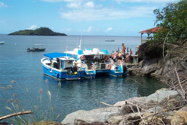 Erik is getting off the dive boat (catamaran)